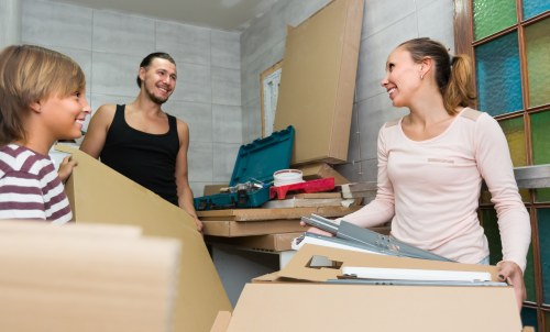 Furniture removal team handling bulky items in a Wembley residential area