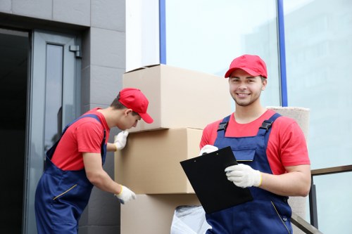 Local moving team handling boxes and furniture near Wembley