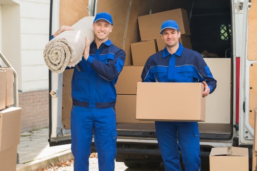 Removal team planning a move in Wembley with boxes and furniture