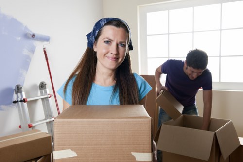 Local moving truck loading boxes and furniture in Wembley