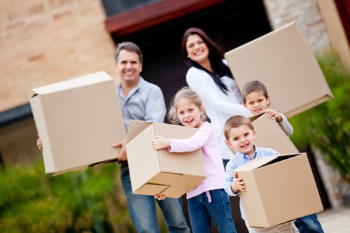 Professional movers loading household furniture for a Wembley relocation
