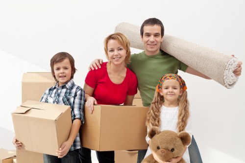 Office relocation process with boxes, desks, and equipment arranged for transport